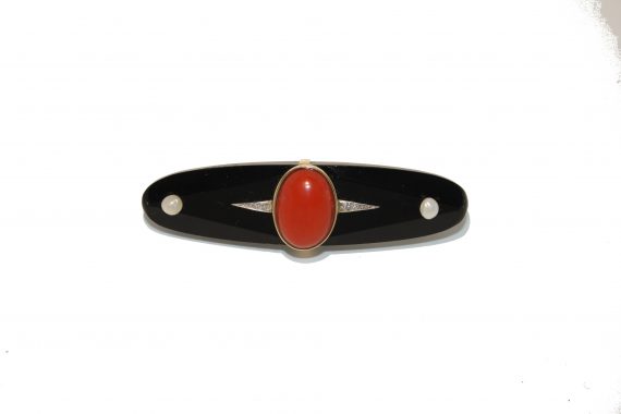 Onyx and coral brooch